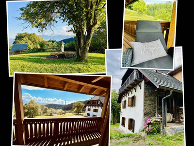 Der Außenbereich des Ferienhauses mit Rasenfläche, verschiedenen Balkonen und Blick auf die umliegende Berglandschaft. Der Außenbereich des Ferienhauses mit Rasenfläche, verschiedenen Balkonen und Blick auf die umliegende Berglandschaft.